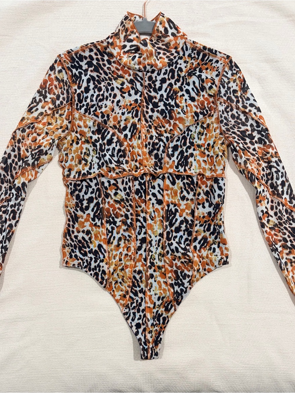 REVOLVE women’s Long-Sleeve Leopard Print Bodysuit in Orange, Black & White